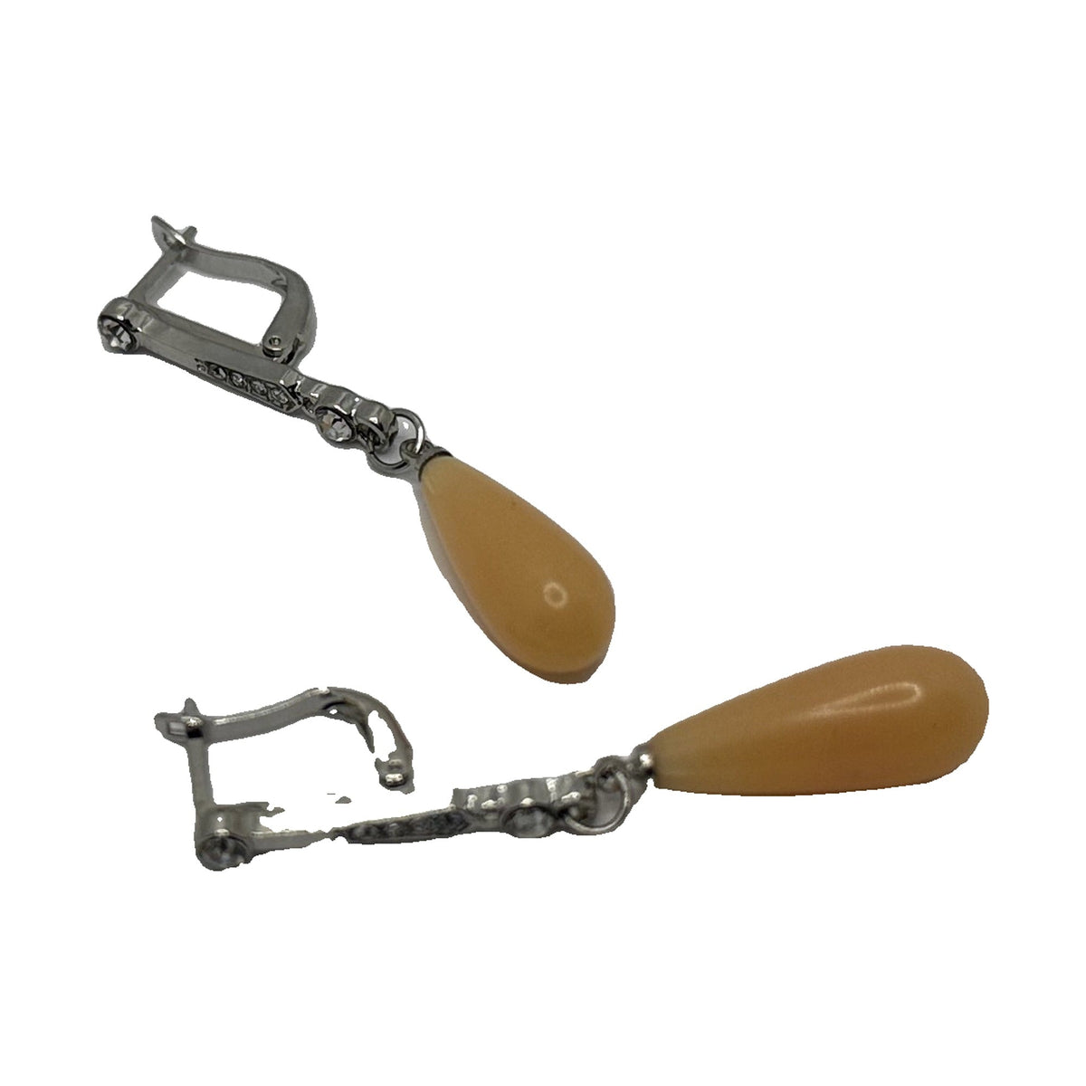 Silver-tone lever-back drop earrings with a butterscotch-yellow teardrop, angled view