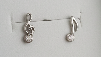 Mismatched music note stud earrings, treble clef and eighth note, silver-tone with clear rhinestone