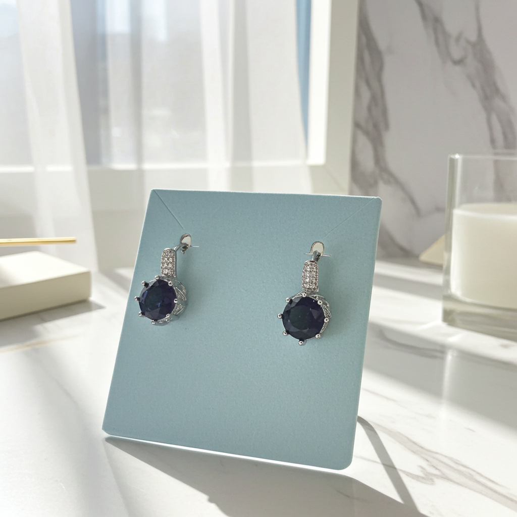 Purple rhinestone round drop earrings with a silver-tone pave cap, post backs, detail view