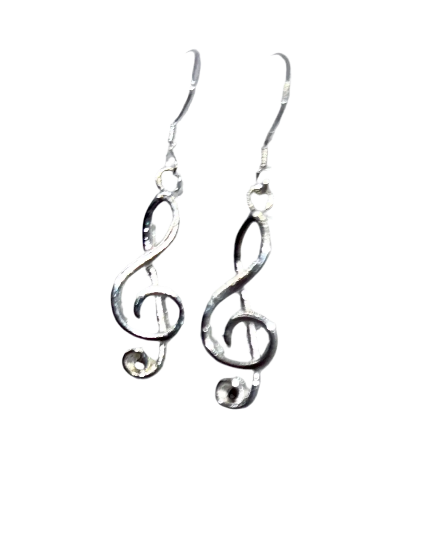 Silver-tone treble clef dangle earrings on French hook ear wires, angled view