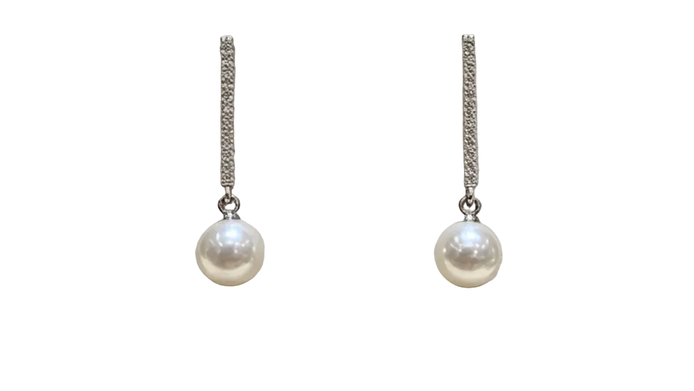 Faux pearl drop earrings with silver-tone pave bar, plain background, no props