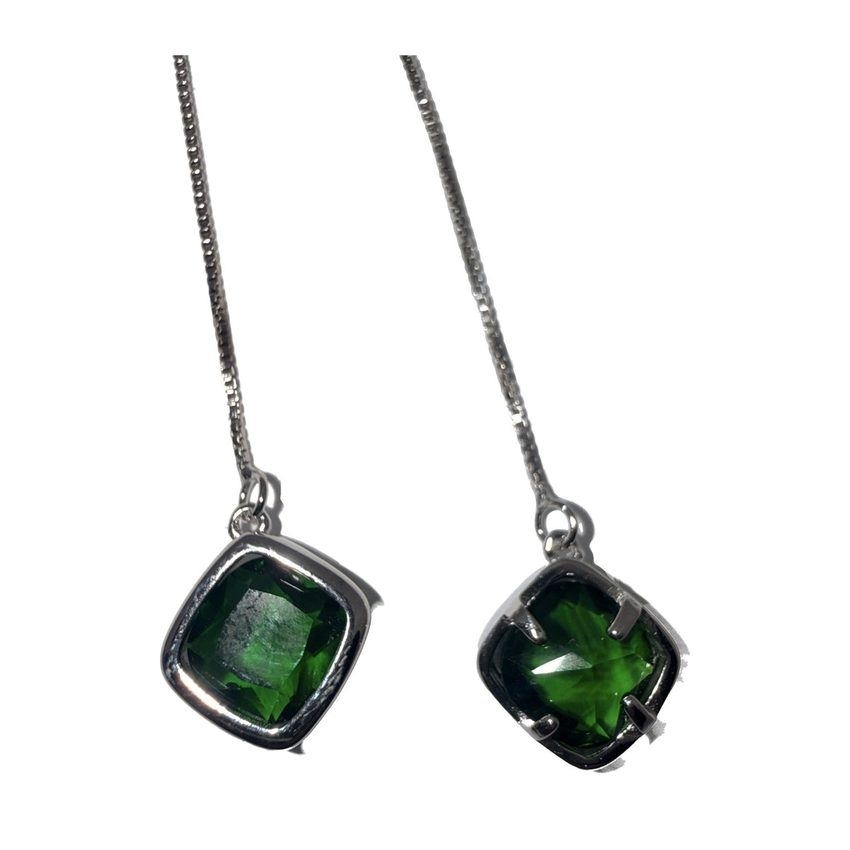 Silver-tone chain threader earrings with green stone drops, close angled view