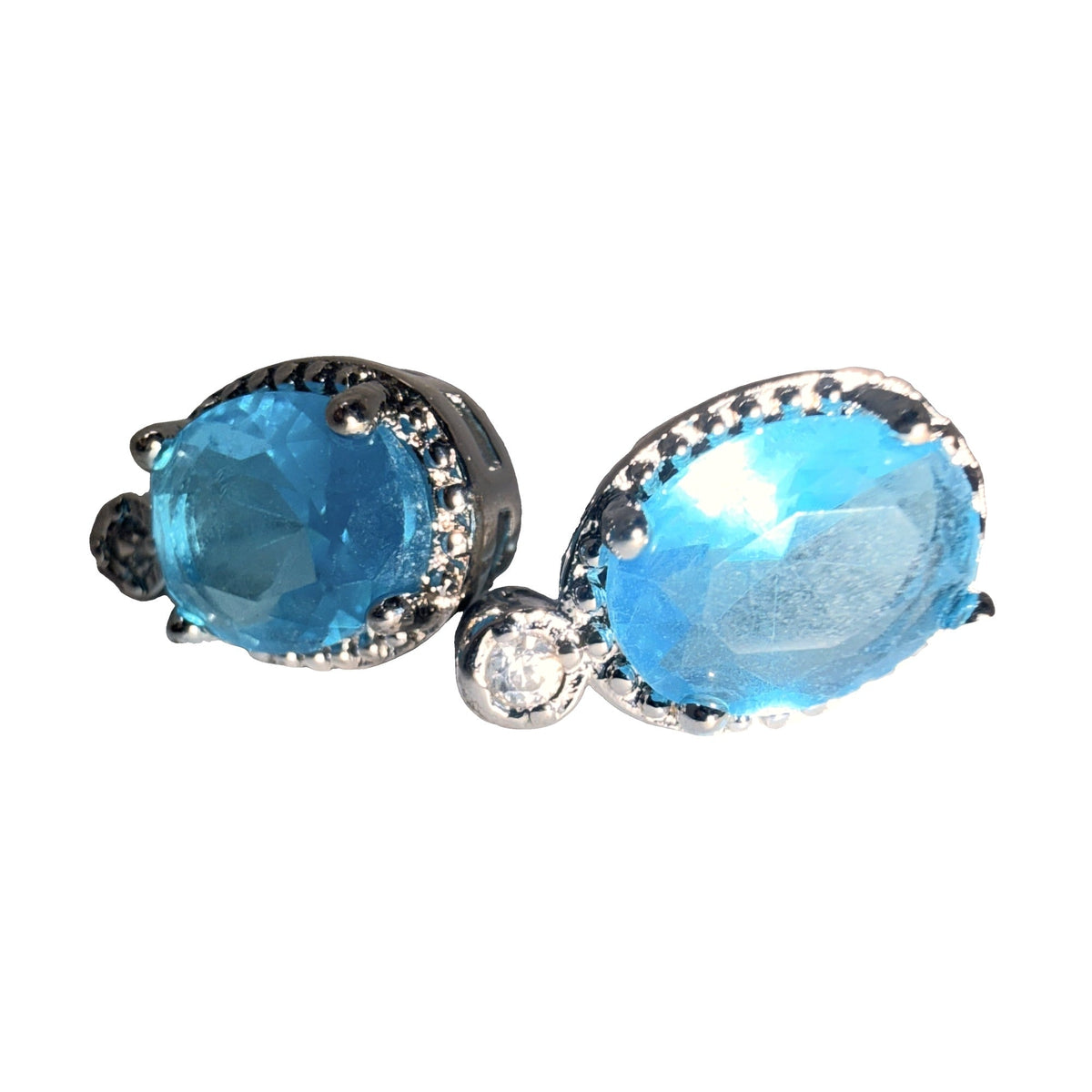 Silver-tone drop earrings with oval blue stones, close detail view
