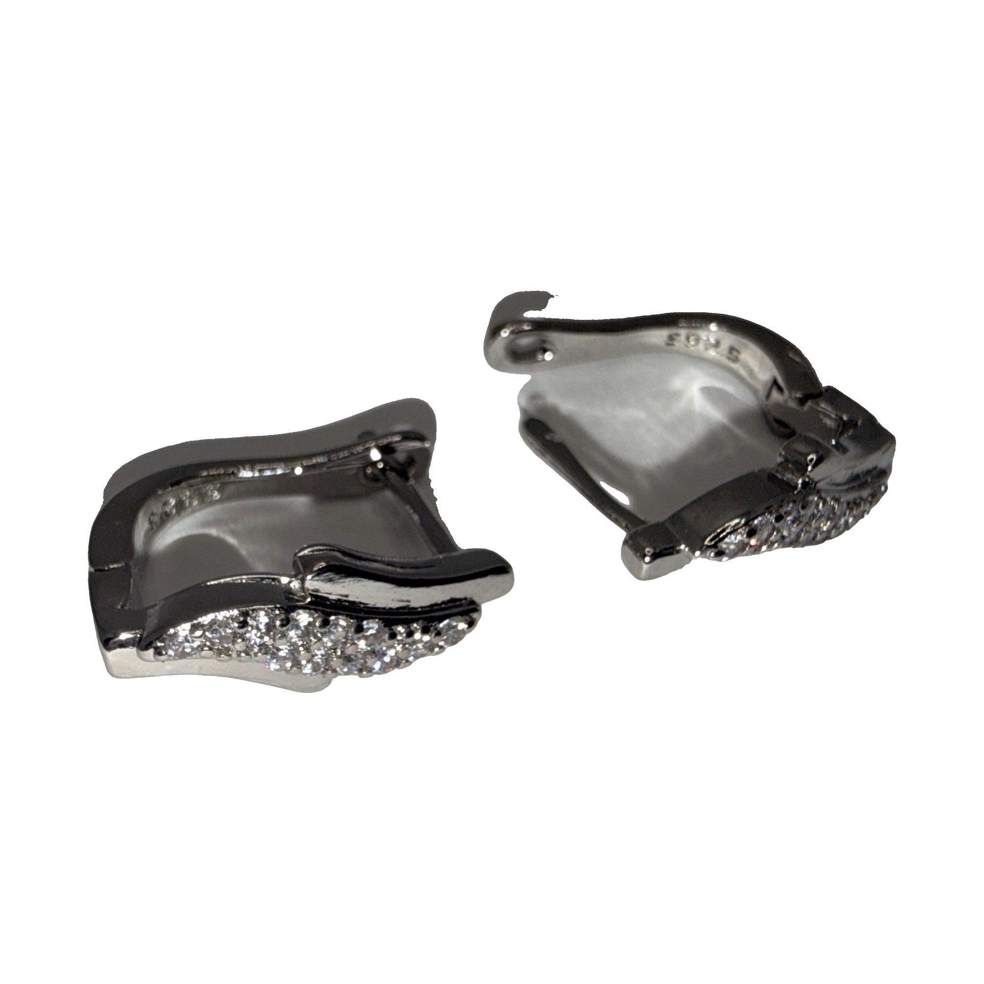 Silver-tone wave huggie earrings with clear rhinestone pave, angled view