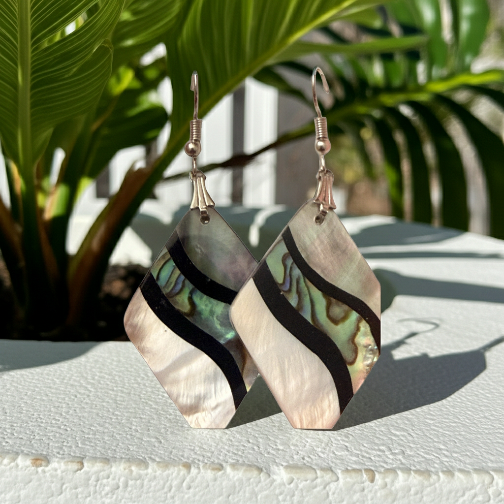 Shell-look kite drop earrings in iridescent green-blue and white with black banding, on silver-tone French hook ear wires, further view